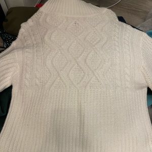 White knitted turtleneck sweater